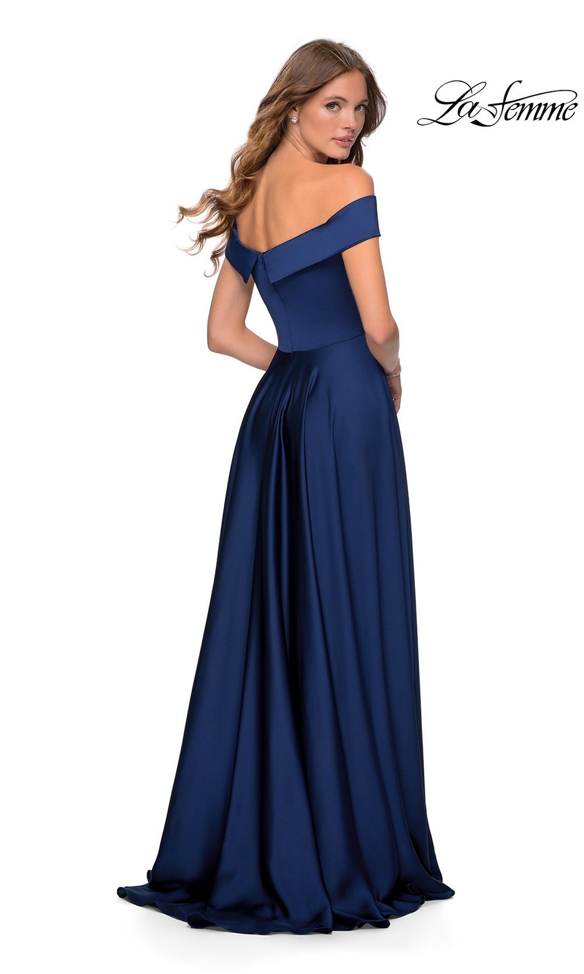 A woman stands with her back turned wearing the La Femme Off-Shoulder Long A-Line Prom Dress 28978 in navy blue, with the La Femme logo displayed in the upper right corner.